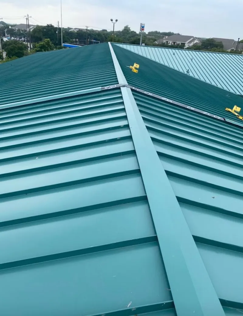 Green commercial metal roof ridge and valley for Metal Roof Repair in Grafton